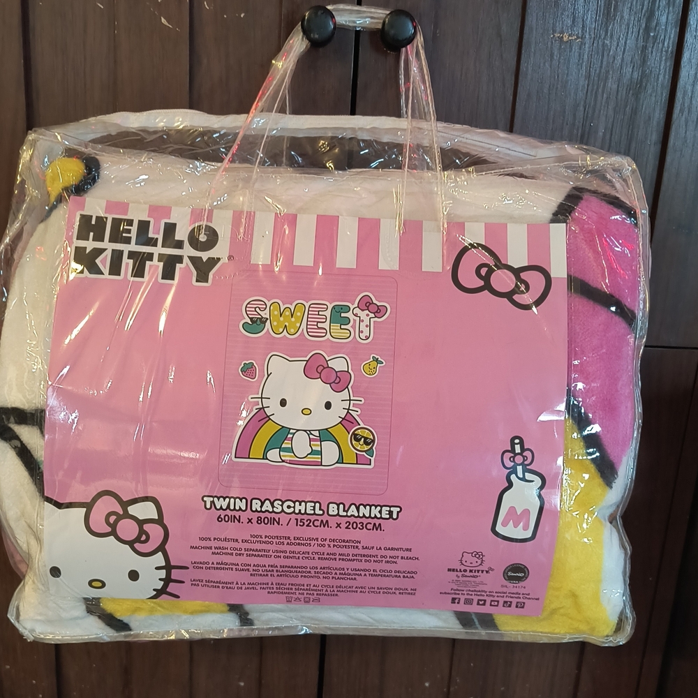 Hello Kitty Pink and Yellow Blanket with Playful Design